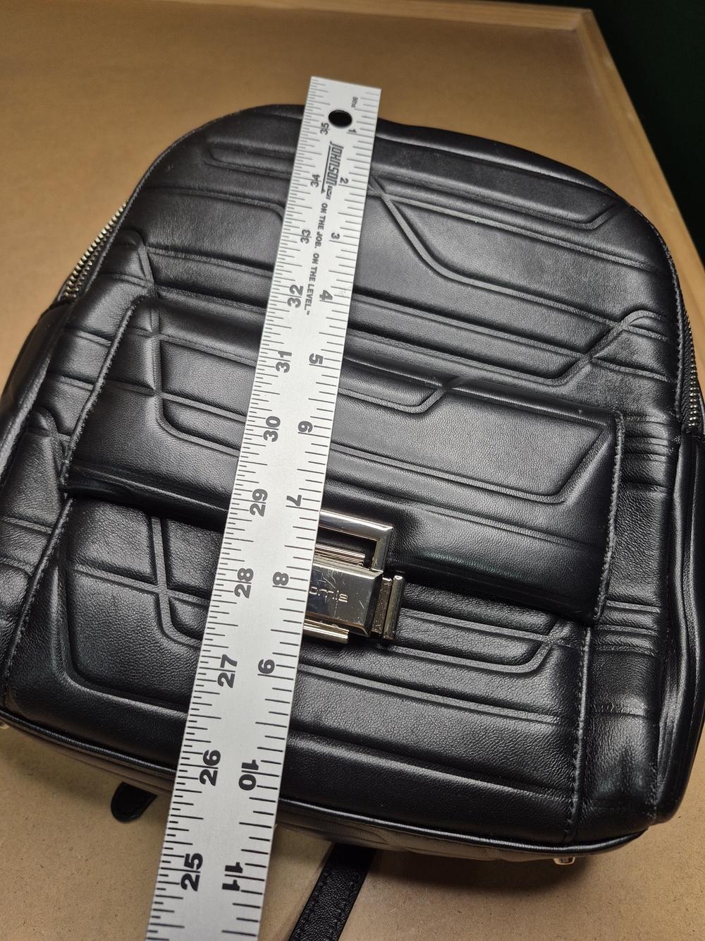 Black Quilted Leather Backpack with Polished Metal Clasp - Picture 3 of 11